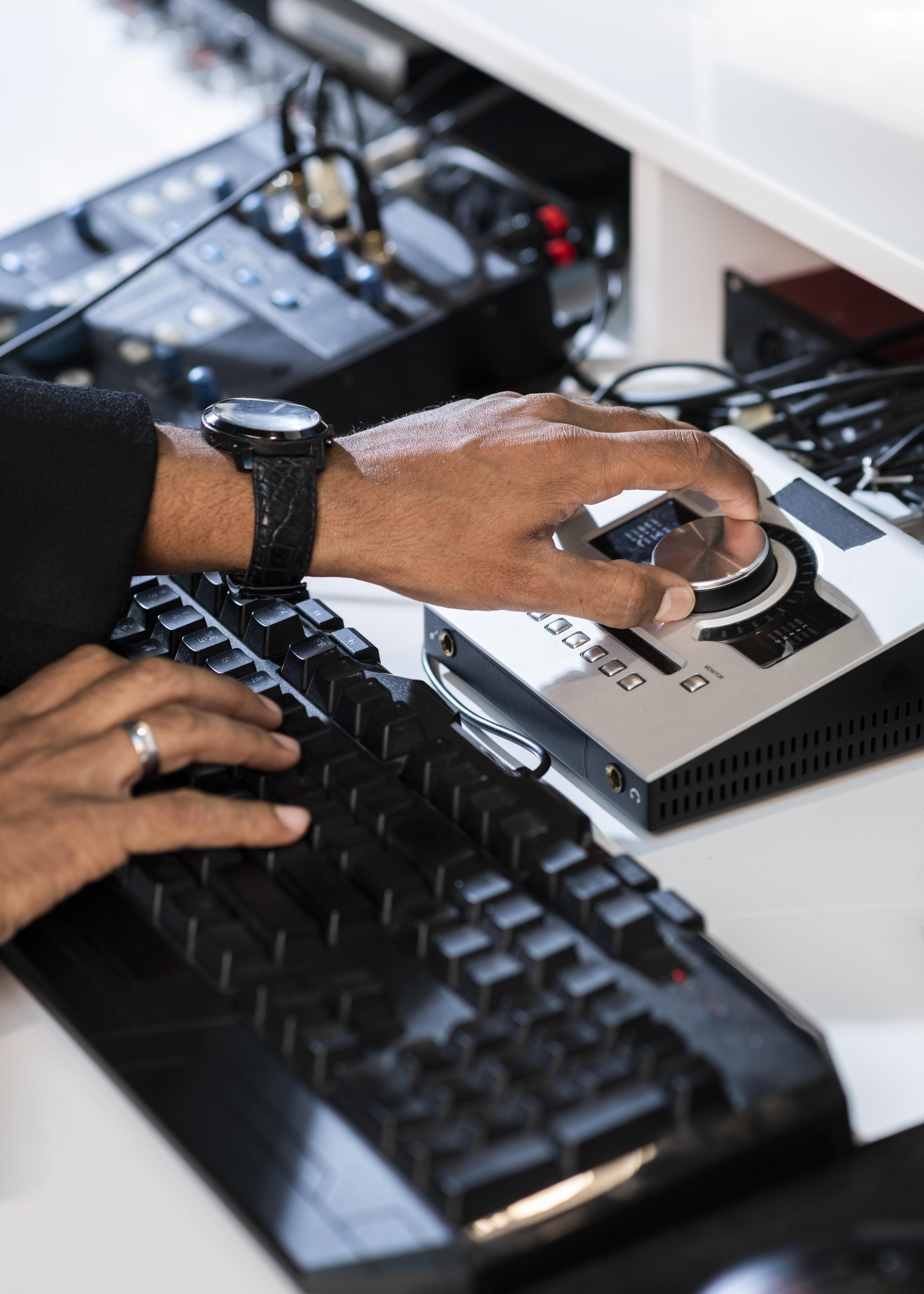 young-man-hands-working-radio-station